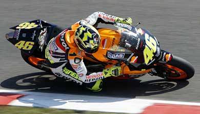 Moto GP class rider Italian Valentino Rossi takes a curve during a training session