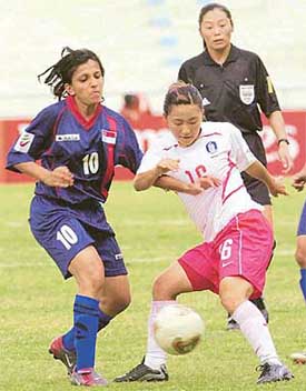 Singapore's Nazreen Ranu vies for the ball with South Korea's Shin Sun-Nam