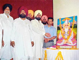 Mr Sardul Singh, Minister for Excise, and Mr Malkiat Singh Birmi, Minister of State for Jails, pay obeisance to Bhagat Kabir