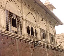 The marble structure has been punctured to hold up the arc lights