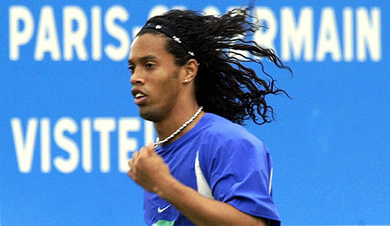 Brazilian striker Ronaldinho exercises during a team practice session