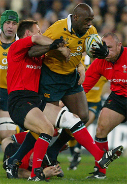 Australia's Wendell Sailor being tackled by Mark Jones of Wales