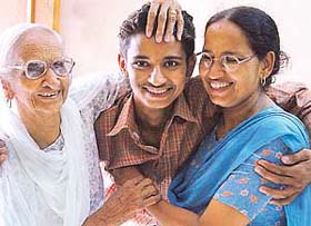 Tejinder Singh Virk, a student of SAS Nagar, his mother and grandmother are all smiles after he stood second in the state in the Class XII examination (arts) of the Punjab School Education Board in Kharar
