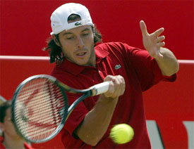 France's Sebastien Grosjean hits a forehand return to Andy Roddick of the US