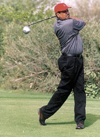 Former cricket captian Kapil Dev taking part in the Christel House Open Golf Tournament at Classic Golf Resort, Gurgaon, on Monday.