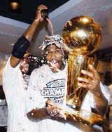 San Antonio Spurs' David Robinson and Kevin Willis celebrate after clinching the NBA championship title
