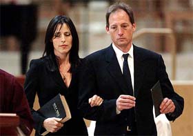 Cecilia and Anthony Peck, daughter and son of late actor Gregory Peck, leave the altar following a memorial service for their father 