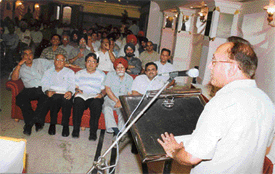 Mr M.N.A. Chaudhary, Commissioner, Income Tax, addresses a seminar