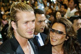 England captain David Beckham and his wife Victoria at Narita Airport