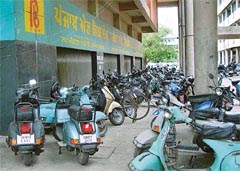 Haphazardly parked two-wheelers in a corridor of a bank building in Sector 17