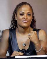 Boxer Laila Ali poses during a news conference