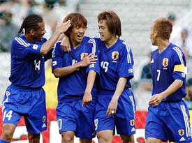 Japan's Shunsuke Nakamura celebrates his goal