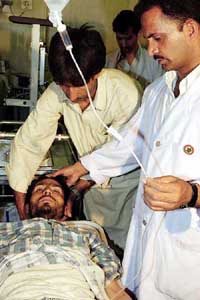 A civilian being treated for splinter injuries