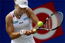 Top seed Kim Clijsters of Belgium returns the ball to German Barbara Rittner