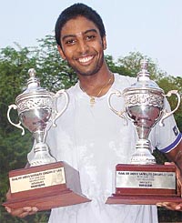 Prakash Amritraj with the Single and Double Trophy's of the ITF men's satellite circuit at the Delhi lawn Tennis Association Deco-turf court here today