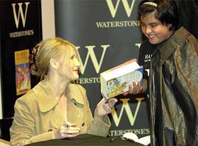 The author of the Harry Potter books, J.K. Rowling, signs her new book