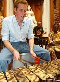 Britain�s Prince William plays the marimba during a rehearsal with the Shakarimba band
