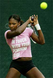 Serena Williams of the US warms up on the practice courts