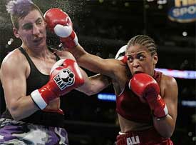 WIBA Super Middleweight Champion Laila Ali delivers a blow to opponent Valerie Mahfood 