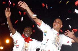 Real Madrid's Brazilian striker Ronaldo and his teammate Claude Makelele celebrate their team's Spanish soccer league victory
