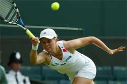 Belgium's Kim Clijsters plays a return to Rossana Neffa-De los Rios of Paraguay