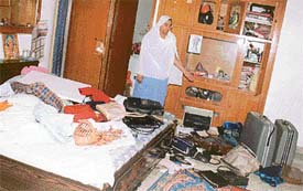 Ms Rajinder Kaur Bulara shows a ransacked room of her house at Jugiana village, near Sahnewal
