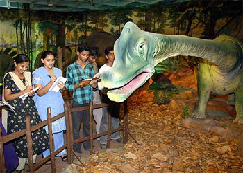 Students gather details about the Brachiosaurus, a pre-historic creature from the Jurassic period