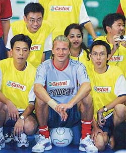 Football star David Beckham poses with fans in Kuala Lumpur