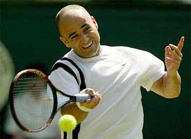 Second seed Andre Agassi of the US plays a return to Britain's Jamie Delgado