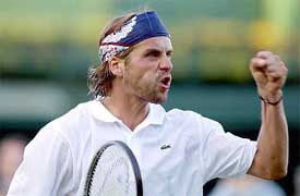 France's Arnaud Clement reacts during his match against Robby Ginepri 