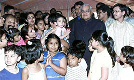 Prime Minister Atal Behari Vajpayee with the children of Indian embassy staff