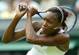 Venus Williams of the US plays a return to Katarina Srebotnik of Slovenia 