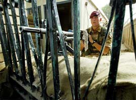 A British paratrooper stands guard at British Embassy in Baghdad 