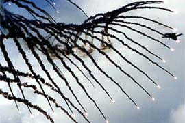A Russian Sukhoi Su-27 jet fighter releases flare during a show in St. Petersburg