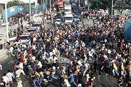 Some 20,000 unemployed Brazilians run for a chance to apply for a job as garbage collector in Rio de Janeiro