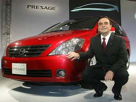 Nissan Motors Company Chief Executive Officer Carlos Ghosn poses next to the company's new Presage minivan