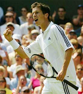 Britain's Tim Henman celebrates his victory over France's Michael Llodra
