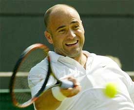 Andre Agassi of the US plays a return to Germany's Lars Burgsmuller