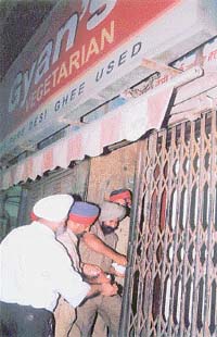 MC officials seal a restaurant, Gyan�s Vegetarian, near the Clock Tower for violating fire-safety norms