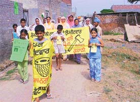 Women and children campaign in support of their candidates for the panchayat elections at Mullanpur village