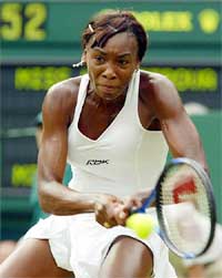 Number four seed Venus Williams of the US plays a return to Nadia Petrova of Russia