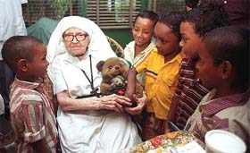 Sister Florence of Oxford Mission with children on her 100th birthday in Kolkata