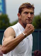 Max Mirnyi of Belarus celebrates his victory over Croatia's Ivo Karlovic