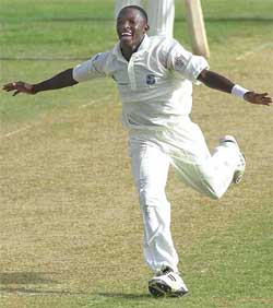 West Indies fast bowler Fidel Edwards celebrates after taking the wicket for LBW of Sri Lanka's Kumar Sangakkara