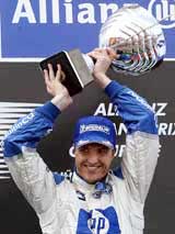 Germany's BMW Williams driver Ralf Schumacher lifts up the trophy