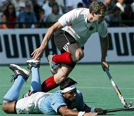 Christoph Bechmann of Germany jumps over India�s Jugraj Singh