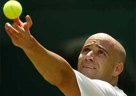 Number two seed Andre Agassi of the US serves to Younes El Aynaoui 