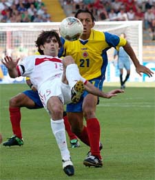 Ibrahim Usulmez of Turkey struggles against Jairo Patino of Colombia in their Confederations Cup final