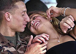 Cpl Miguel Henao, a member of the 2nd Marine Expeditionary Brigade, enjoys a quiet moment with his wife Angelica as they are reunited on Saturday at Camp Lejeune, after he returned from combat duty in Iraq