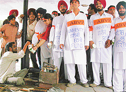 ABVP members seek donations in protest against the fee hike in Sector 17, Chandigarh, on Monday. 